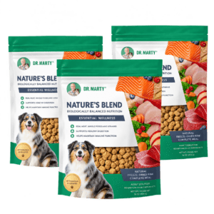Three pouches of Nature's Blend dog food featuring an Australian Shepherd, colorful ingredients and the Nature's Blend logo.